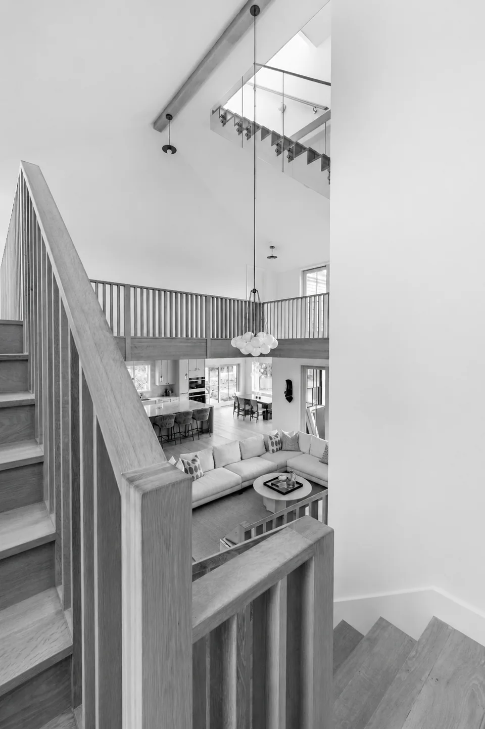 Stair and double-height living space at Polpis 01